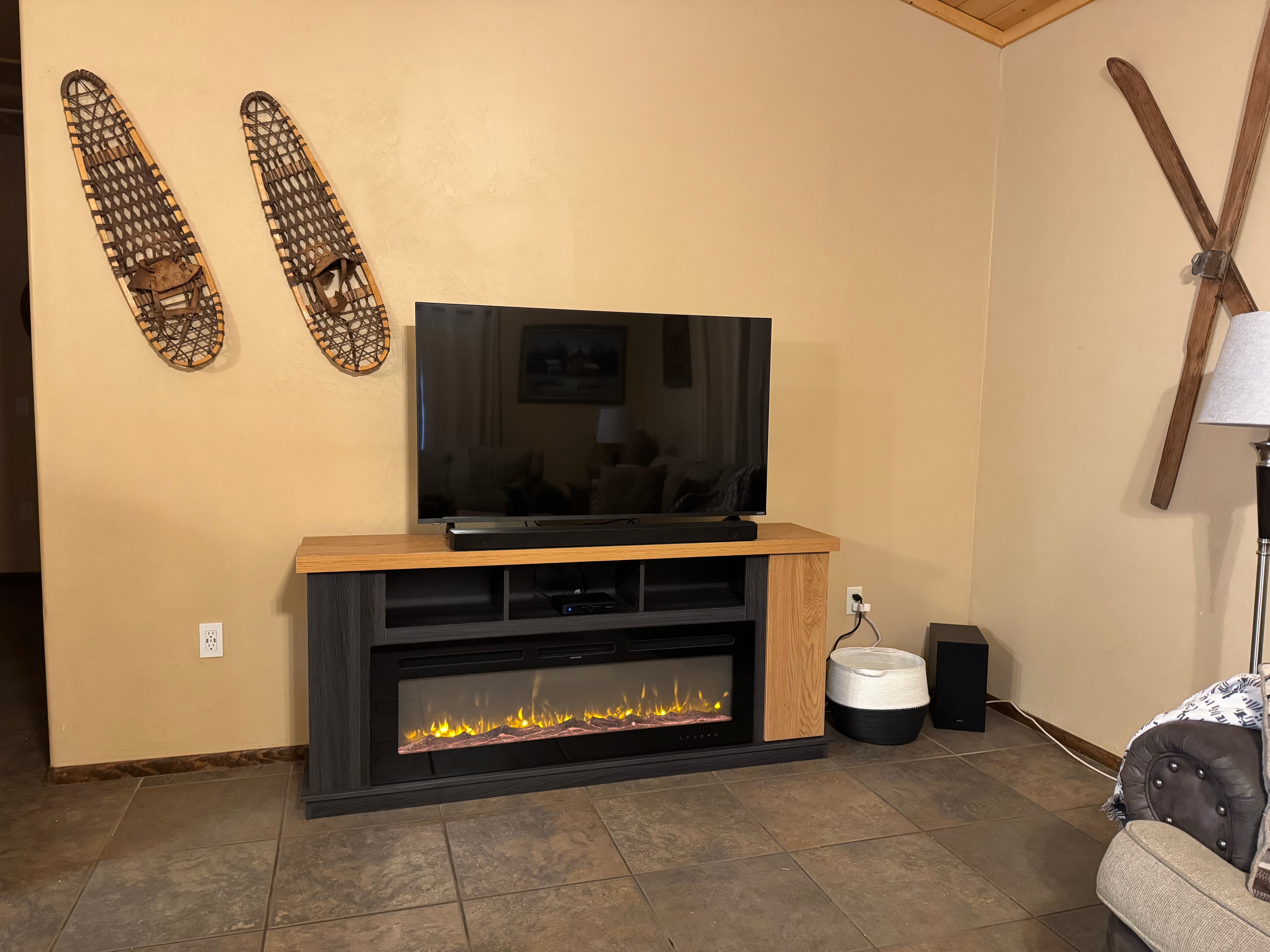 Living room with fireplace & snowshoes